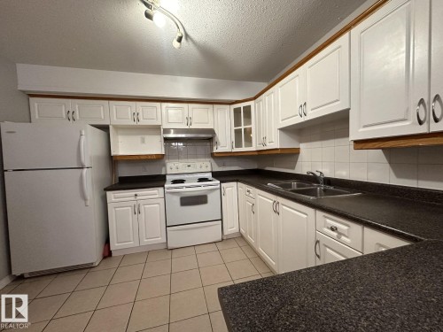 2 2505 42 Street, Edmonton, AB - Indoor Photo Showing Kitchen With Double Sink