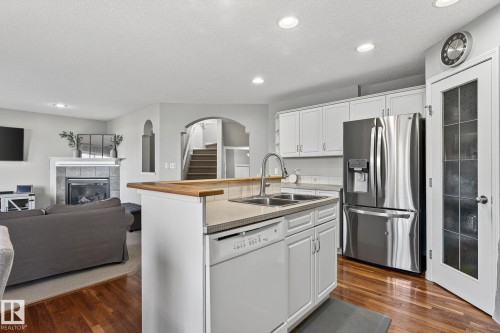 1147 Rutherford Close, Edmonton, AB - Indoor Photo Showing Kitchen With Fireplace With Double Sink