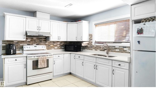 4337 21 Avenue, Edmonton, AB - Indoor Photo Showing Kitchen With Double Sink