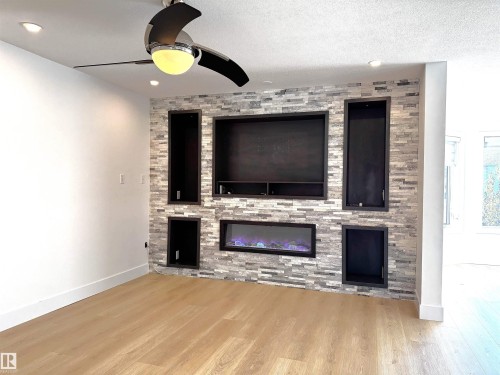 4337 21 Avenue, Edmonton, AB - Indoor Photo Showing Living Room With Fireplace
