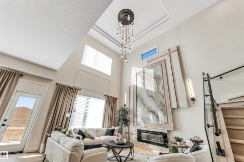 7663 Kimiwan Crescent, Edmonton, AB - Indoor Photo Showing Living Room With Fireplace