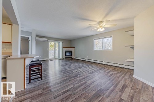 405 7725 108 Street, Edmonton, AB - Indoor Photo Showing Living Room With Fireplace