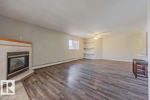 405 7725 108 Street, Edmonton, AB - Indoor Photo Showing Living Room With Fireplace