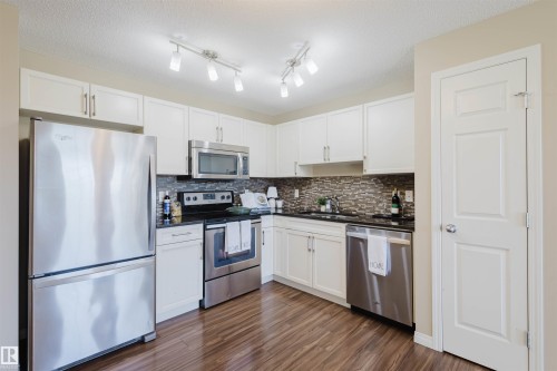 60 4029 Orchards Drive, Edmonton, AB - Indoor Photo Showing Kitchen With Stainless Steel Kitchen