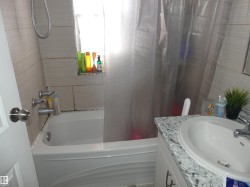 Bathroom featuring vanity and shower / bath combination with curtain - 