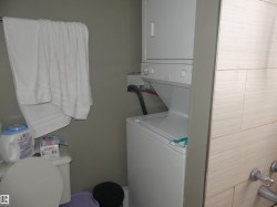 Washroom with stacked washing machine and dryer - 