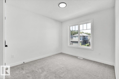 1154 Gyrfalcon Crescent, Edmonton, AB - Indoor Photo Showing Other Room