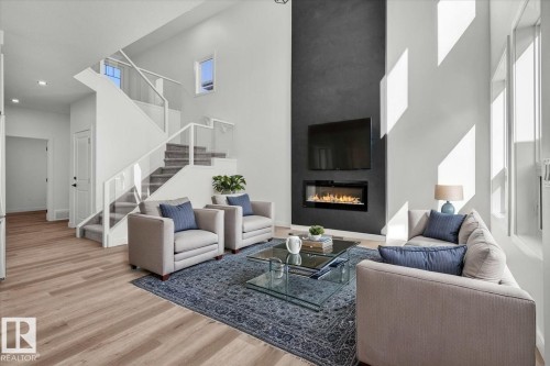 1154 Gyrfalcon Crescent, Edmonton, AB - Indoor Photo Showing Living Room With Fireplace