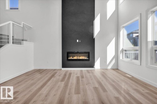 1154 Gyrfalcon Crescent, Edmonton, AB - Indoor Photo Showing Living Room With Fireplace