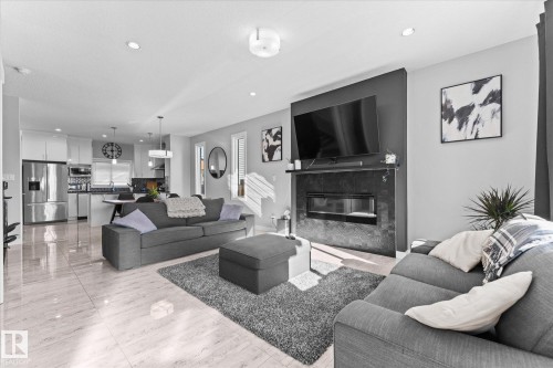 3510 48 Avenue, Beaumont, AB - Indoor Photo Showing Living Room With Fireplace
