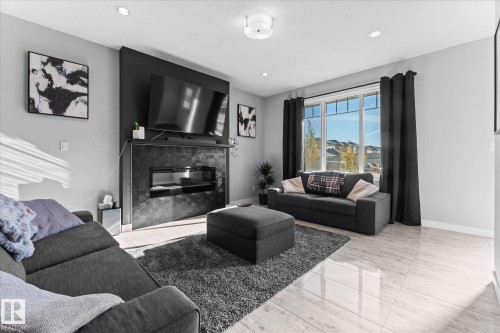 3510 48 Avenue, Beaumont, AB - Indoor Photo Showing Living Room With Fireplace