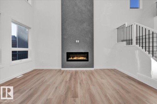 1115 Gyrfalcon Crescent, Edmonton, AB - Indoor Photo Showing Living Room With Fireplace