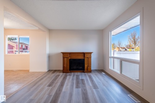 13341 47 Street, Edmonton, AB - Indoor Photo Showing Living Room With Fireplace