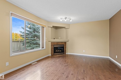 63 1128 156 Street, Edmonton, AB - Indoor Photo Showing Living Room With Fireplace
