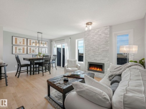 112 Santana Crescent, Fort Saskatchewan, AB - Indoor Photo Showing Living Room With Fireplace