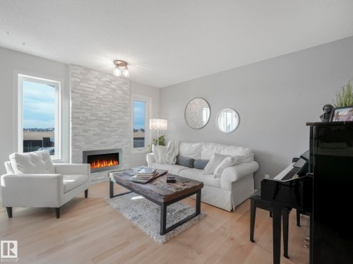 112 Santana Crescent, Fort Saskatchewan, AB - Indoor Photo Showing Living Room With Fireplace