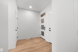 Entryway featuring wood finished floors and recessed lighting - 
