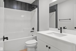 Bathroom with bathtub / shower combination and vanity - 