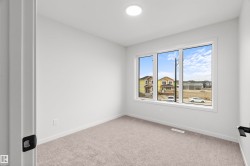 Spare room with light carpet and baseboards - 