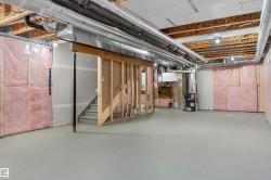 Unfinished below grade area featuring heating unit - 