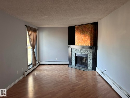 17 10721 116 Street, Edmonton, AB - Indoor Photo Showing Living Room With Fireplace