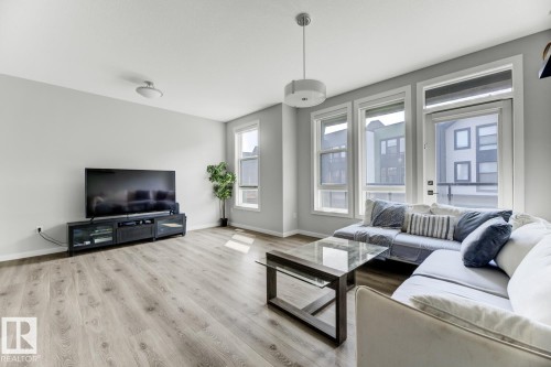 114 1304 Rutherford Rd, Edmonton, AB - Indoor Photo Showing Living Room