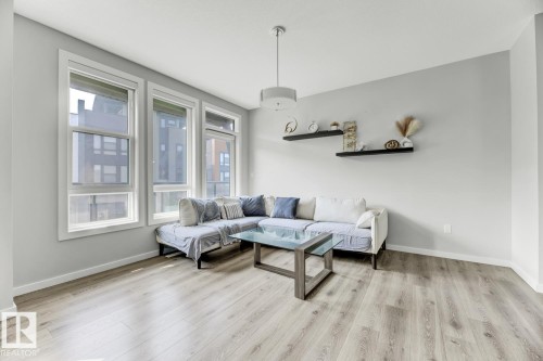 114 1304 Rutherford Rd, Edmonton, AB - Indoor Photo Showing Living Room