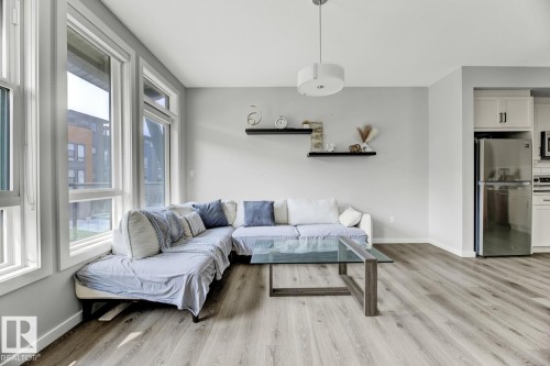 114 1304 Rutherford Rd, Edmonton, AB - Indoor Photo Showing Living Room