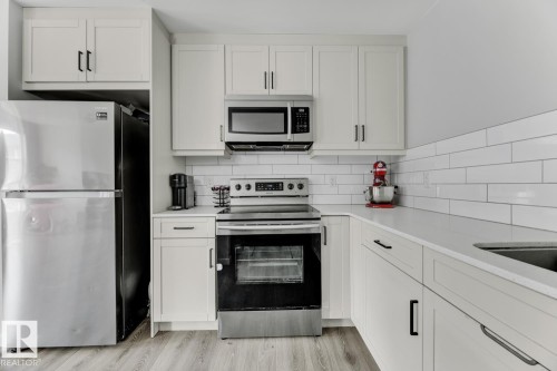 114 1304 Rutherford Rd, Edmonton, AB - Indoor Photo Showing Kitchen With Stainless Steel Kitchen With Upgraded Kitchen