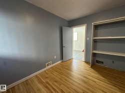 Unfurnished bedroom with light wood finished floors and a closet - 