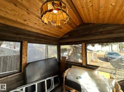 Sunroom with lofted ceiling and healthy amount of natural light - 