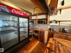 Kitchen featuring wooden counters and stainless steel appliances - 