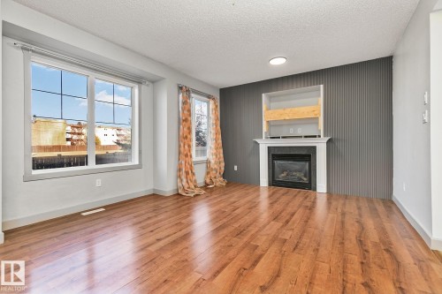40 14208 36 Street, Edmonton, AB - Indoor Photo Showing Living Room With Fireplace