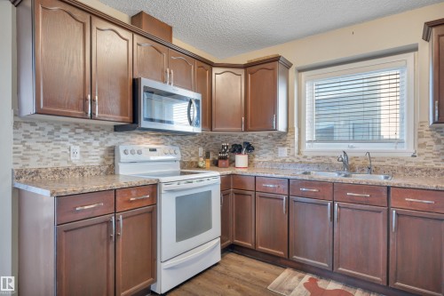 113 Pipestone Drive, Millet, AB - Indoor Photo Showing Kitchen With Double Sink