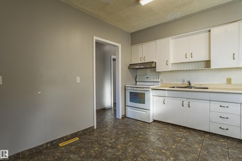 12716 12718 94 Street, Edmonton, AB - Indoor Photo Showing Kitchen With Double Sink