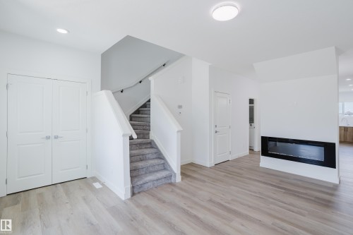 263 Munn Way, Leduc, AB - Indoor Photo Showing Other Room With Fireplace