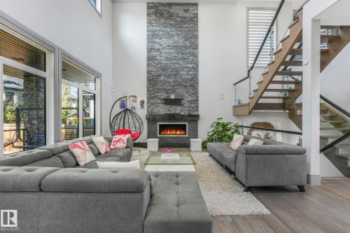 3510 Watson Point(E), Edmonton, AB - Indoor Photo Showing Living Room With Fireplace
