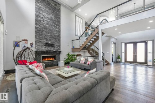 3510 Watson Point(E), Edmonton, AB - Indoor Photo Showing Living Room With Fireplace