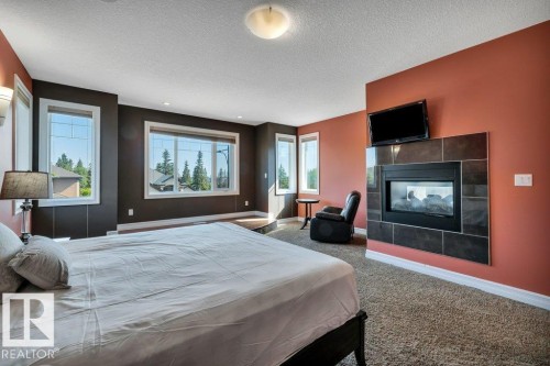 1211 Adamson Drive, Edmonton, AB - Indoor Photo Showing Bedroom With Fireplace