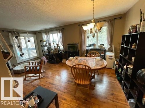 208 14803 51 Avenue, Edmonton, AB - Indoor Photo Showing Dining Room With Fireplace