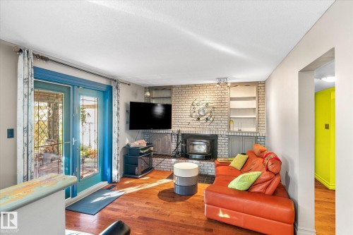 3018 110A Street, Edmonton, AB - Indoor Photo Showing Living Room With Fireplace