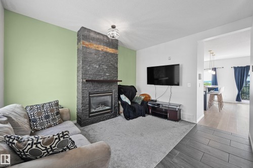 91 13825 155 Ave, Edmonton, AB - Indoor Photo Showing Living Room With Fireplace