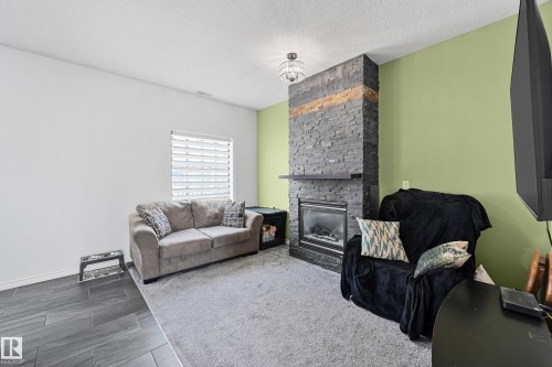 91 13825 155 Ave, Edmonton, AB - Indoor Photo Showing Living Room With Fireplace