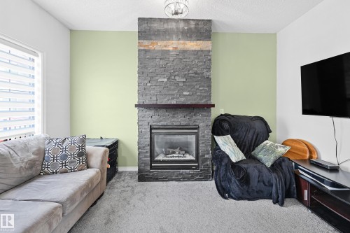 91 13825 155 Ave, Edmonton, AB - Indoor Photo Showing Living Room With Fireplace