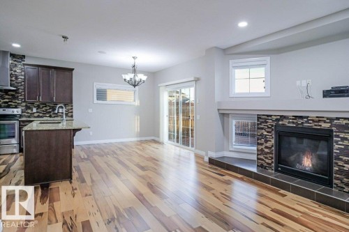 7913 Erasmus Crescent, Edmonton, AB - Indoor Photo Showing Living Room With Fireplace