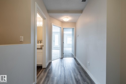 130 5151 Windermere Boulevard, Edmonton, AB - Indoor Photo Showing Other Room
