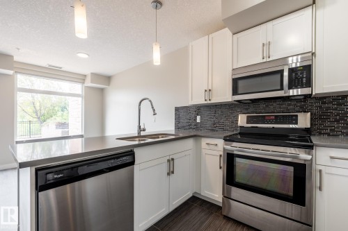 130 5151 Windermere Boulevard, Edmonton, AB - Indoor Photo Showing Kitchen With Double Sink