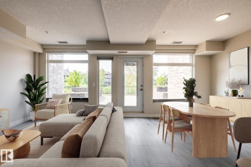 130 5151 Windermere Boulevard, Edmonton, AB - Indoor Photo Showing Living Room