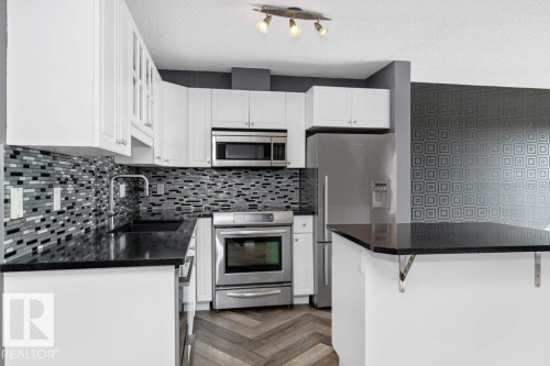 214 10105 95 Street, Edmonton, AB - Indoor Photo Showing Kitchen With Double Sink With Upgraded Kitchen