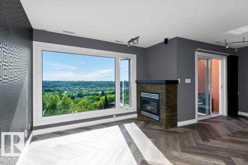 214 10105 95 Street, Edmonton, AB - Indoor Photo Showing Living Room With Fireplace